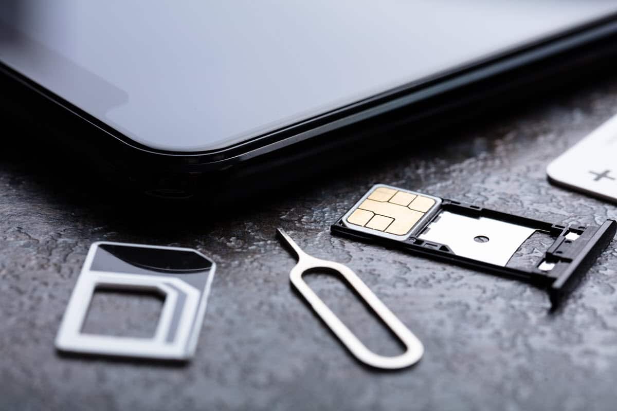 mobile phone, sim card and eject tool